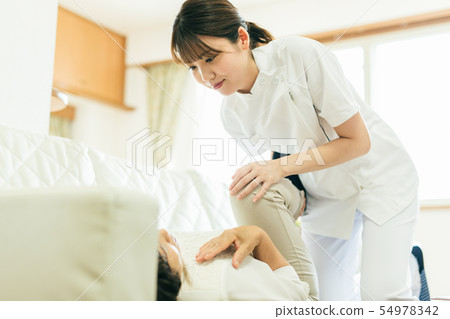 Physiotherapist PT senior woman Physiotherapist PT senior woman 54978342