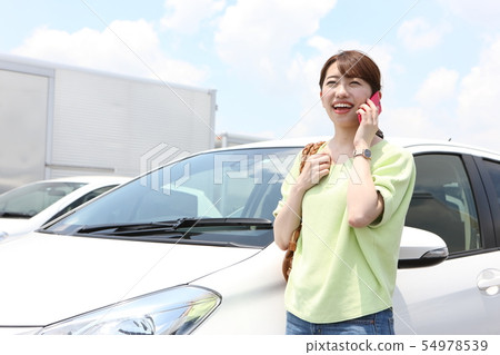 Young woman with car Young woman with car 54978539