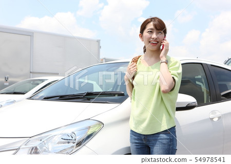 Young woman with car Young woman with car 54978541
