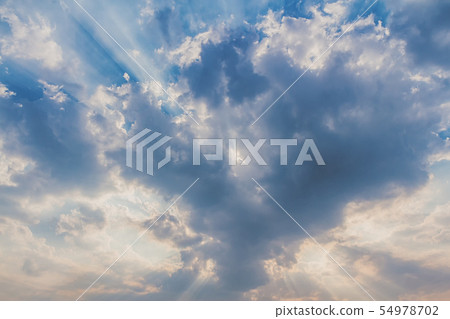 Besutiful ray of sunlight breaking through clouds Besutiful ray of sunlight breaking through clouds 54978702
