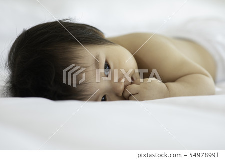 Cute Sweet Adorable Asian Baby happiness in cozy 54978991