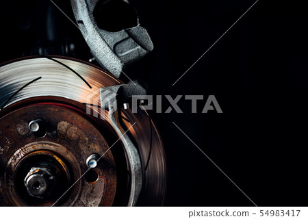 Disc brake and asbestos brake pads at car garage 54983417