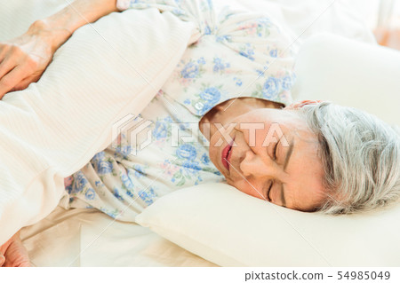 Senior woman sleeps asleep Senior woman sleeps asleep 54985049
