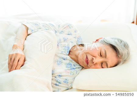 Senior woman sleeps asleep Senior woman sleeps asleep 54985050