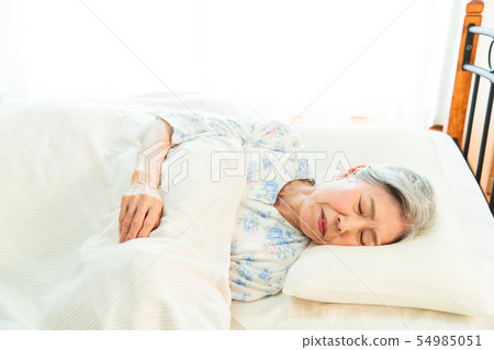 Senior woman sleeps asleep Senior woman sleeps asleep 54985051
