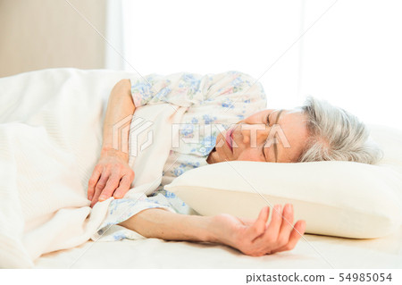 Senior woman sleeps asleep 54985054