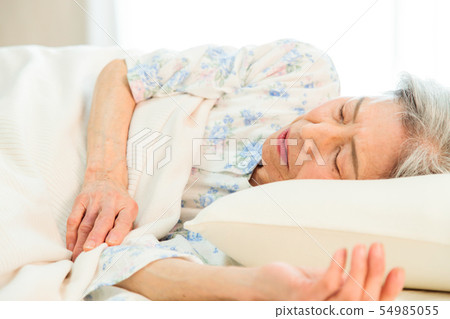 Senior woman sleeps asleep Senior woman sleeps asleep 54985055