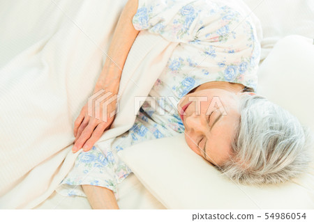 Senior woman sleeps asleep Senior woman sleeps asleep 54986054