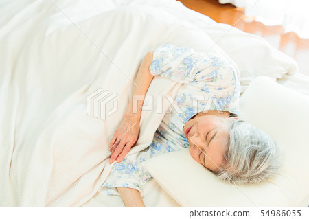 Senior woman sleeps asleep Senior woman sleeps asleep 54986055