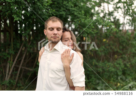 Young loving couple hugging and dancing on the Young loving couple hugging and dancing on the 54988116