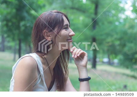 Portrait of a sweet and slightly smiling woman. Portrait of a sweet and slightly smiling woman. 54989509