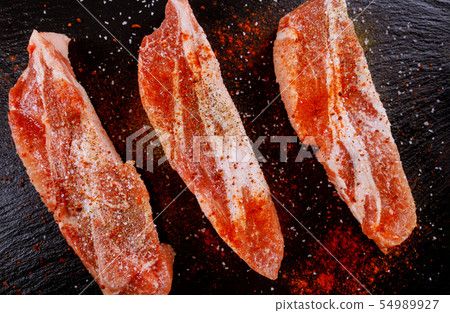 Boneless pork chops seasoned with dried  54989927