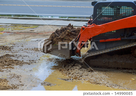 Bucket wheeled loader on the construction. Bucket wheeled loader on the construction. 54990085