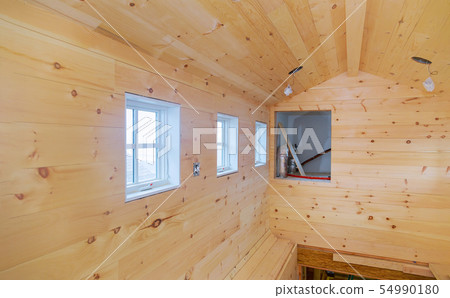 Empty room in a new wooden house under Empty room in a new wooden house under 54990180