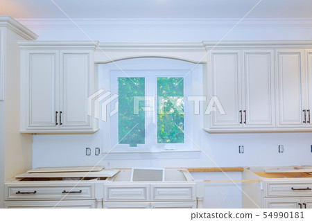 Modern kitchen installation interior cabinets in a Modern kitchen installation interior cabinets in a 54990181