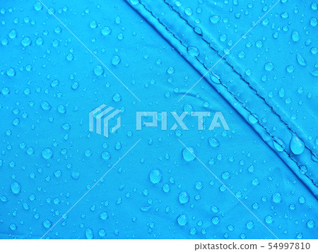 Blue rainproof tent sheet with morning rain drops Blue rainproof tent sheet with morning rain drops 54997810