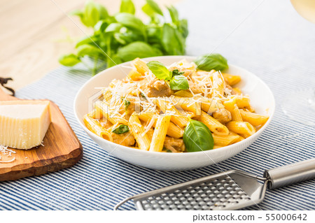 Pasta penne with chicken pieces mushrooms basil 55000642