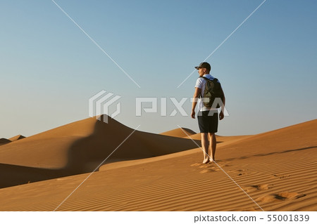 Young tourist in desert Young tourist in desert 55001839