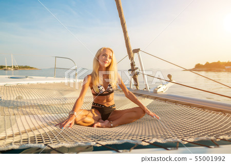 beautiful sexy woman in swimwear relaxing on a yacht front 55001992