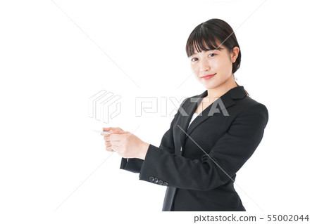 Young career woman presenting a business card Young career woman presenting a business card 55002044