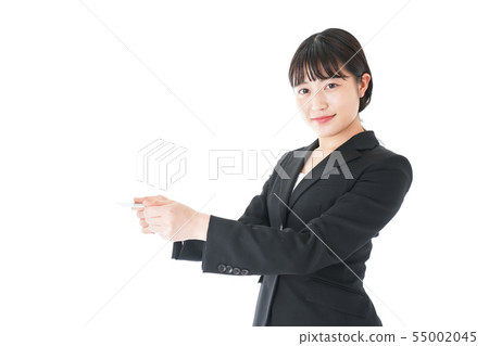 Young career woman presenting a business card 55002045