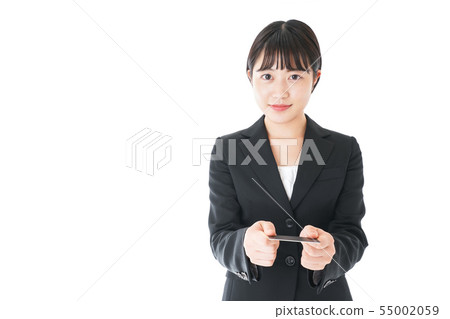 Young career woman presenting a business card Young career woman presenting a business card 55002059