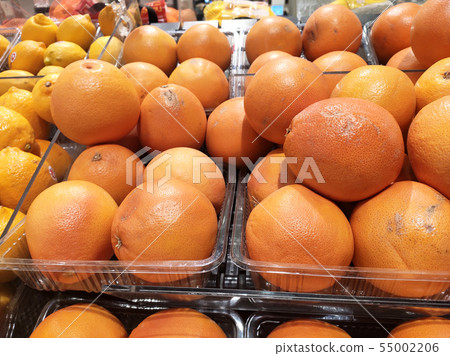 Orange fruit on rack for sale in the supermarkets. 55002206