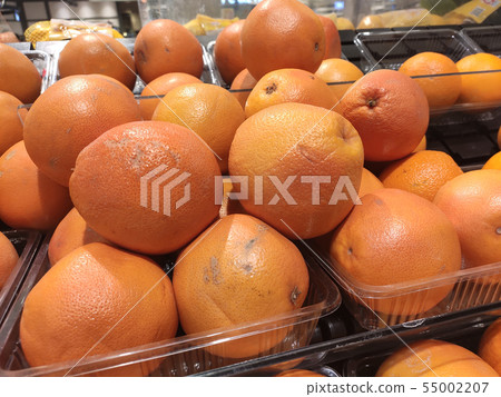 Orange fruit on rack for sale in the supermarkets. 55002207