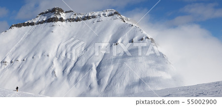 Skiers and off-piste slope with traces of skis, 55002900