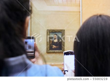 Visitors take photo of Leonardo DaVinci's Mona Lisa at the Louvre Museum 55003219