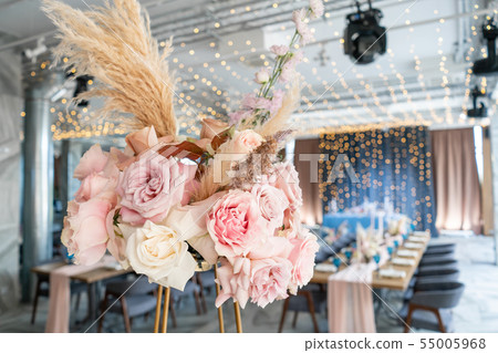 Wedding Banquet or gala dinner. The chairs and table for guests, served with cutlery and crockery Wedding Banquet or gala dinner. The chairs and table for guests, served with cutlery and crockery 55005968
