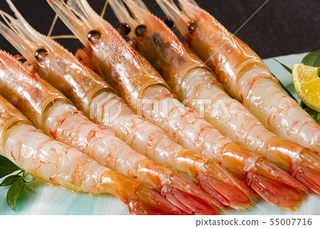 Serve delicious shrimp side by side 55007716