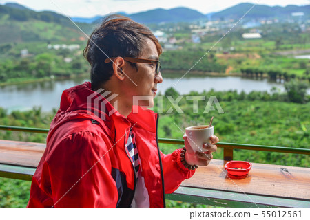 A young man at mountain view coffee shop A young man at mountain view coffee shop 55012561