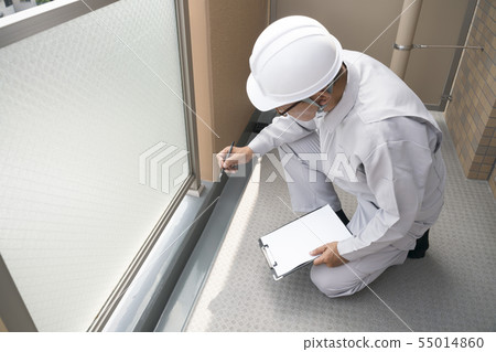 Businessman checking the apartment balcony 55014860