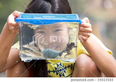Girl observing a creature Girl observing a creature 55015583