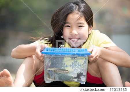 Girl observing a creature 55015585