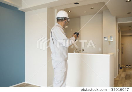 Businessman in helmet housing renovation general purpose 55016047