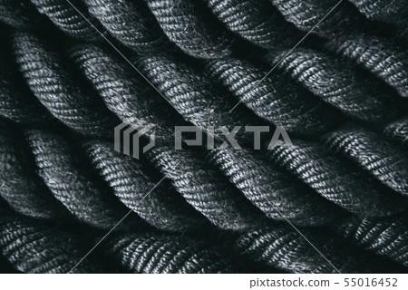 Close up of black battle rope for functional training. Sport and fitness equipment. Close up of black battle rope for functional training. Sport and fitness equipment. 55016452