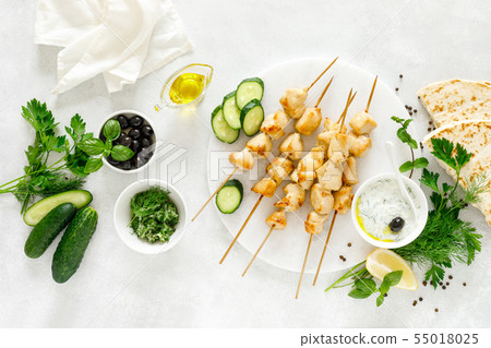 Grilled chicken kebab on skewers and traditional Grilled chicken kebab on skewers and traditional 55018025