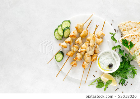 Grilled chicken kebab on skewers and traditional 55018026
