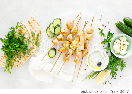 Grilled chicken kebab on skewers and traditional Grilled chicken kebab on skewers and traditional 55018027