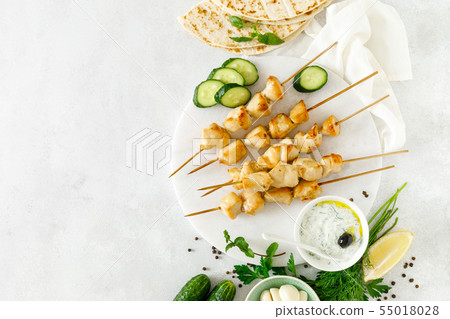 Grilled chicken kebab on skewers and traditional Grilled chicken kebab on skewers and traditional 55018028