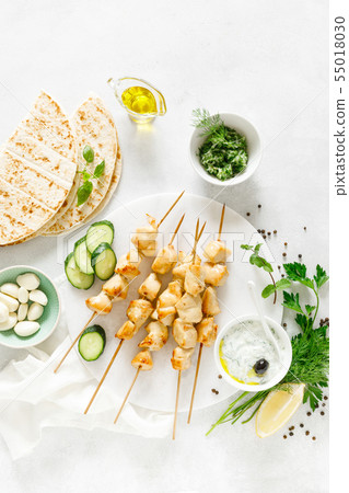 Grilled chicken kebab on skewers and traditional 55018030