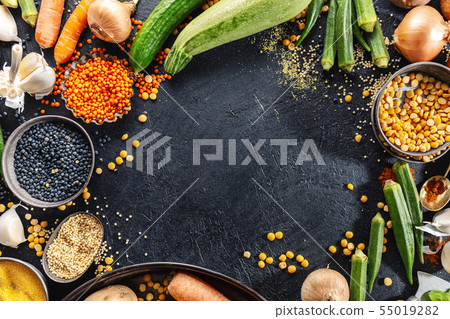 Variety of fresh tasty vegetables on dark 55019282
