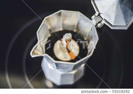Moka coffee cooking in pot on the stove Moka coffee cooking in pot on the stove 55019292