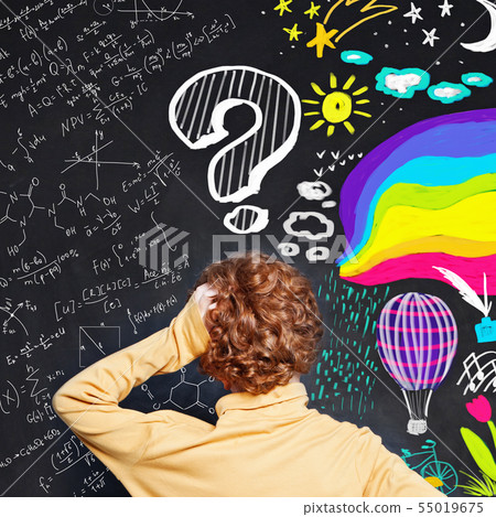 Little boy with question mark on blackboard 55019675