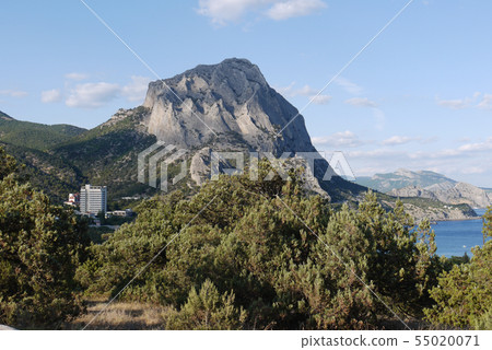 Mountains with rocks near the sea coast. On the be Mountains with rocks near the sea coast. On the be 55020071