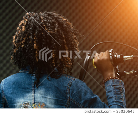 African Teenager Woman Afro hair sing a song 55020645