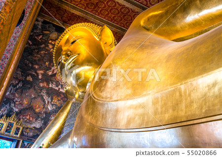Giant golden reclining Buddha statue in Wat Pho 55020866