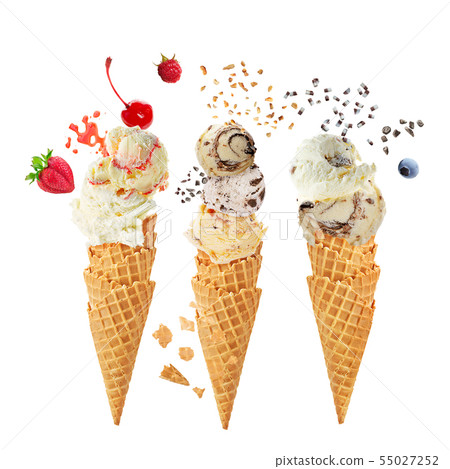 Variety of ice cream scoops in cones with 55027252